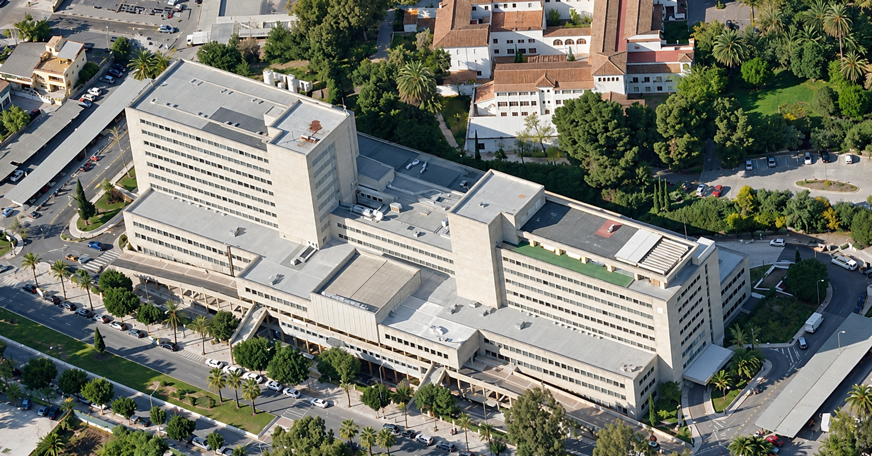 AI-enhanced archive aerial photograph of Hospital Materno Infantil de Málaga.